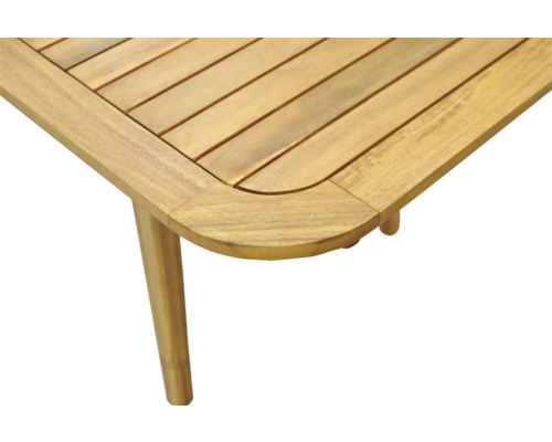 Vue détaillée d'un plateau de table de jardin en bois avec des coins arrondis et un pied de table