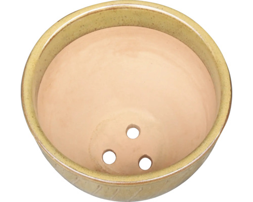 Pot de fleurs en céramique avec trois trous pour le drainage
