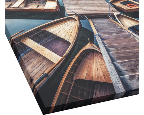 Leinwandbild mit Holzbooten an einem Steg