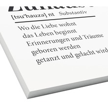 Dekoratives Wandbild mit dem Text Wo die Liebe wohnt, das Leben beginnt.