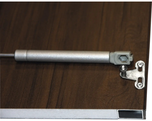 Vérin à gaz pour meubles sur une surface en bois