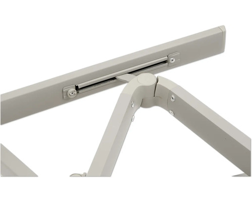 Vue détaillée d'une table pliante avec cadre métallique et pièces de connexion.