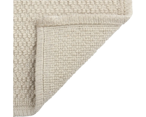 Vue détaillée d'un tapis à texture tissée