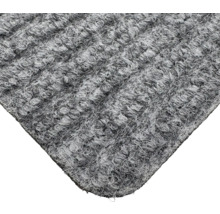 Detailansicht eines grauen Teppichs mit strukturierter Oberfläche