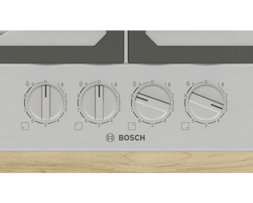Detailansicht eines Kochfelds mit vier Drehreglern und dem Bosch Logo