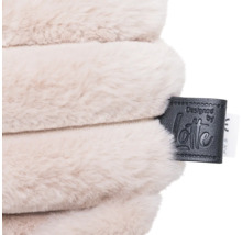 Coussin avec étiquette conçue par Lotte