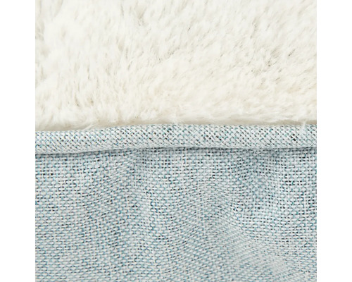 Detailansicht eines Tierbetts mit Textiloberfläche und weichem Plüsch