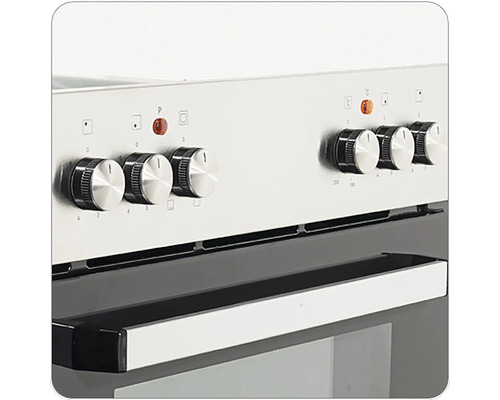 Gros plan d'une cuisinière avec des boutons rotatifs pour le réglage de la température et la sélection des fonctions.