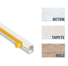 Kabelkanal mit Klebestreifen und Darstellung von Untergründen wie Beton, Tapete und Holz