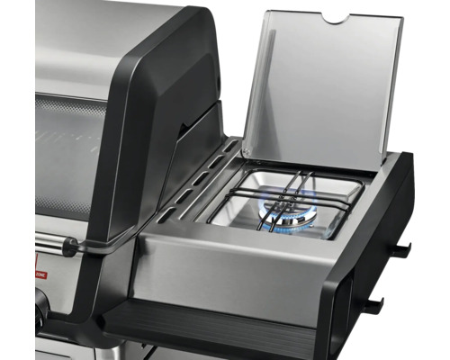 Vue détaillée d'un gril à gaz avec plaque de cuisson allumée.