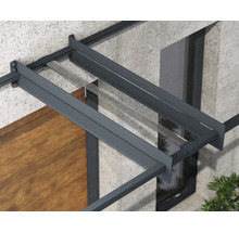Détail d'un auvent avec cadre en aluminium anthracite et couverture en verre transparent sur une façade.