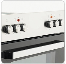 Gros plan d'une cuisinière avec des boutons rotatifs pour régler la température