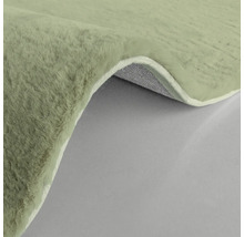 Detailansicht eines Teppichs mit hochflorigem Flor