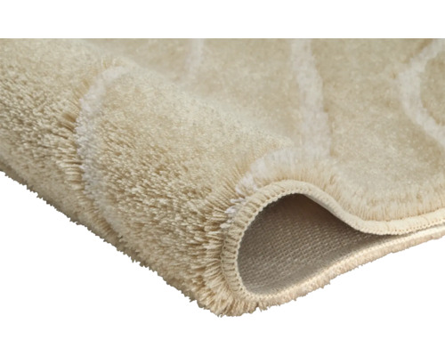 Detailaufnahme eines beigen Teppichs mit Flor