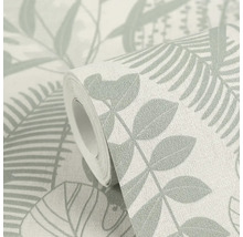 Un rouleau de papier peint à motif de feuilles.