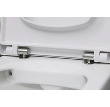 Vue détaillée d'un siège de toilette blanc avec des charnières en acier inoxydable.