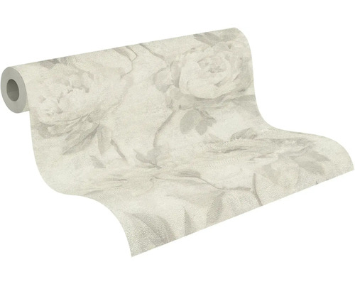 Rouleau de papier peint avec grand motif floral et motifs de feuilles.