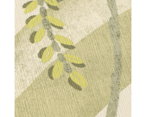 Gros plan d'un papier peint texturé avec un motif botanique de feuilles et de branches.