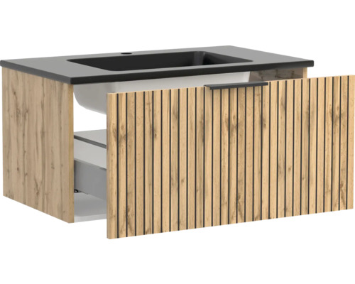 Waschtischunterschrank mit integriertem dunklen Waschbecken und Front in Holzoptik mit vertikalen Lamellen, Schublade leicht geöffnet.