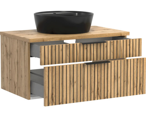 Badmöbel-Set mit Unterschrank in Eichenoptik, Lamellenfront, zwei Schubladen und rundem, schwarzem Aufsatzwaschbecken.