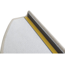 Vue détaillée d'une contremarche de tapis avec des bandes adhésives