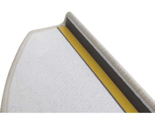 Vue détaillée d'une contremarche de tapis avec des bandes adhésives