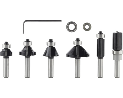 Coffret de fraises en métal pour défonceuse comprenant divers profilés, deux roulements à billes et une clé mâle coudée.