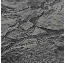 Surface structurée d'un papier peint intissé aspect pierre.