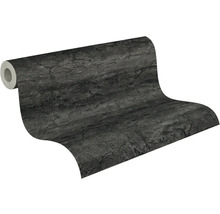 Papier peint intissé aspect pierre et béton avec une surface structurée gris foncé.