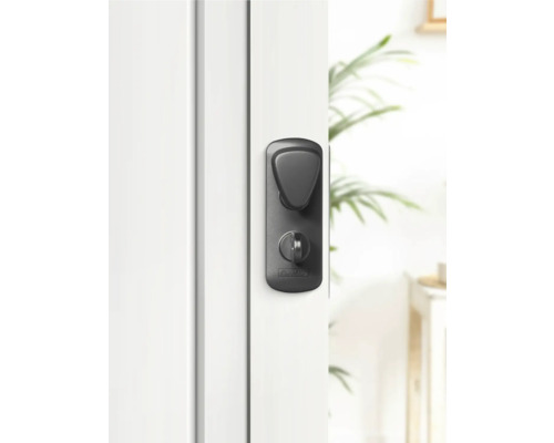 Schwarzer Türdrücker an weisser Tür