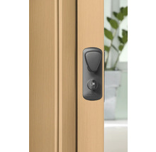 Garniture de porte avec bouton rotatif sur une porte en bois