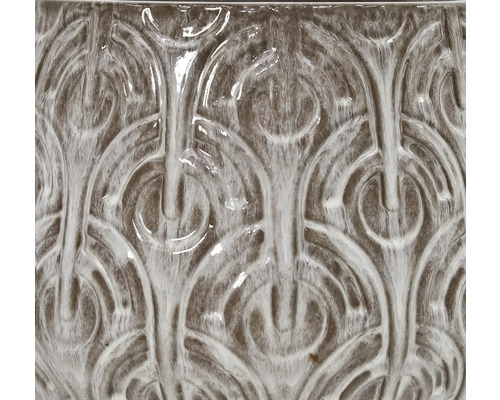 Gros plan d'un récipient en céramique avec motif floral