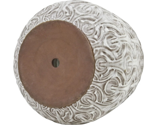 Pot de fleurs avec ornements et trou de drainage dans le fond