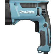 Detailansicht eines Makita Bohrhammers mit Handgriff, Schalter und Makita Logo.