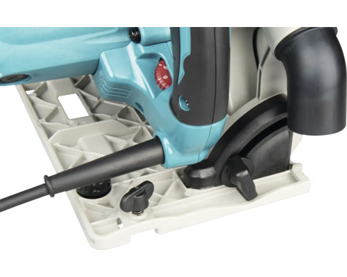Détail de la scie plongeante turquoise avec plaque de base, boutons de réglage noirs, molette de vitesse rouge et raccord pour aspiration.