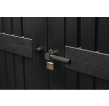 Gros plan d'une porte de jardin sombre avec serrure et poignée