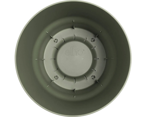 Vue intérieure d'un pot de fleurs rond en plastique avec des fentes de drainage et elho Logo au fond.