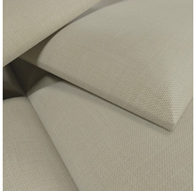 Gros plan d'un tissu tissé beige avec une surface texturée.