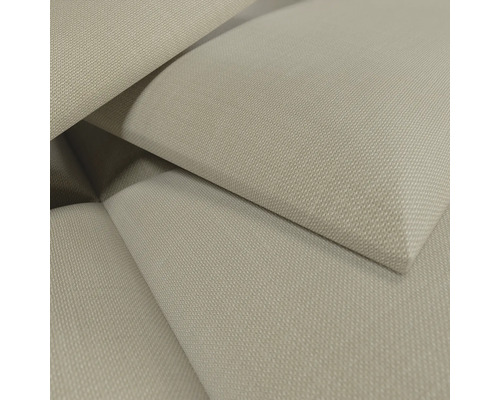 Gros plan d'un tissu tissé beige avec une surface texturée.