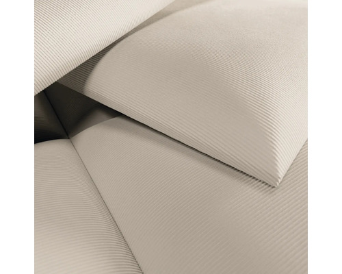 Gros plan d'un tissu en velours côtelé clair.