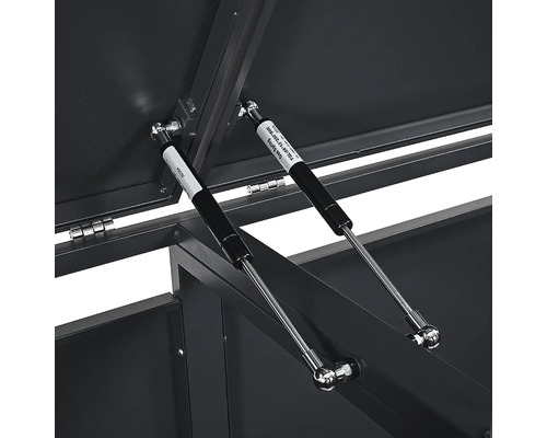 Zwei Gasdruckfedern an einer Aufbewahrungsbox aus Metall zur Unterstützung des Deckels.