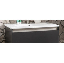 Waschtischunterschrank mit weißem Waschbecken, dunkler Front und Zierleiste in Holzoptik.