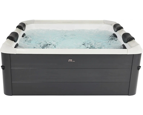 Spa rectangulaire MSpa avec eau bouillonnante et quatre appuie-tête.