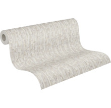 Rouleau de papier peint intissé avec motif à blocs abstraits et texturés.