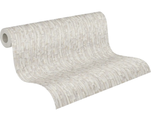 Rouleau de papier peint intissé avec motif à blocs abstraits et texturés.