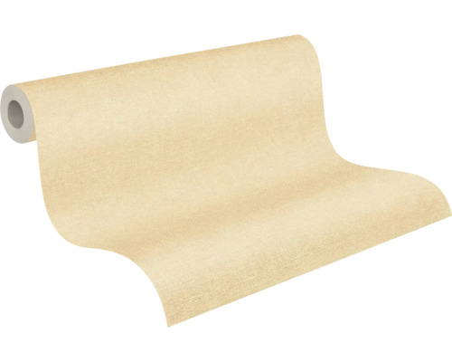Papier peint intissé beige avec une structure fine sur rouleau.