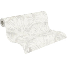 Papier peint intissé avec motif de feuilles abstrait dans des tons clairs, légèrement structuré.