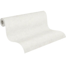 Rouleau de papier peint intissé blanc avec une structure de surface discrète, partiellement déroulé.
