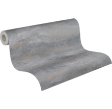 Papier peint intissé aspect béton gris avec surface structurée et éclat métallique.