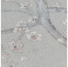 Papier peint intissé structuré avec motif floral de branches d arbres et de fleurs scintillantes.